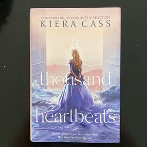 Brand new copy of A Thousand Heartbeats by Kiera Cass